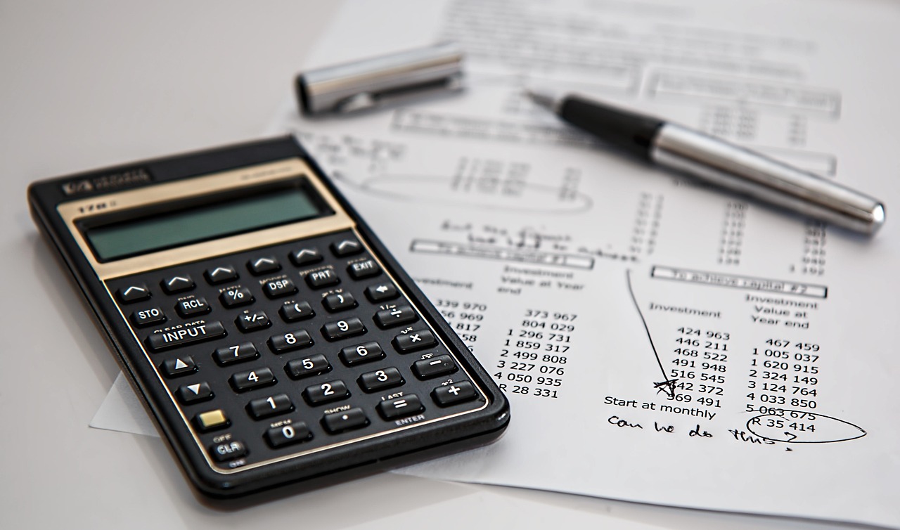 Financial calculator and notepad — implied probability is the bridge between a sportsbook price and the probability it represents